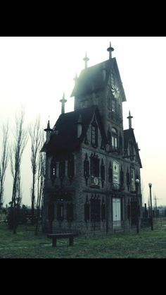 an old building with a clock on the front