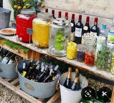 bottles and buckets filled with different types of drinks