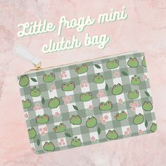 Embrace the adorable charm of our Kawaii Little Frogs Mini Clutch Bag! Perfect for fashion enthusiasts, this bag features cute frog prints, adding a playful touch to your ensemble. Crafted with care, it offers both style and functionality, ideal for those on the move. Made from vegan, cruelty-free leather, our clutch is not just fashionable but also environmentally conscious. Its zip fastener and saffiano pattern finish enhance its elegance. With a single compartment, it accommodates all your da Cute Green Travel Pouch, Cute Green Bag With Removable Pouch, Cute Green Bags For Gifts, Cute Green Coin Purse, Cute Green Coin Purse For Daily Use, Cute Coin Purse Pouch For Travel, Cute Rectangular Coin Purse For School, Green Novelty Bags For Gifts, Green Novelty Bags For Daily Use