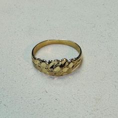 5mm wide in the front, 1mm shank. Marked 14K Not plated, solid 14K yellow gold. Gold Nugget Ring, Gold Nugget, Gold Gold, Solitaire Ring, Halloween Shopping, Jewelry Rings, Ring Size, Accessory Gift, Yellow Gold