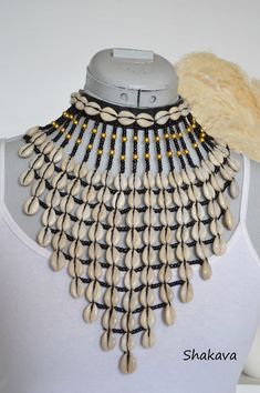 African Collar Necklace, Gold Bohemian Shell For Festival, Beaded Shell Choker Necklace, Bohemian Beaded Choker For Beach, Bohemian Black Shell Jewelry, Handmade Black Shell Necklace In Bohemian Style, Bohemian White Shell Necklace For Festival, Handmade Black Bohemian Shell Necklace, Black Shell Bohemian Jewelry