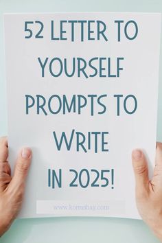 someone holding up a sign that says, 52 letter to yourself prompts to write in 205