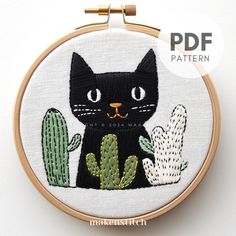 Add a touch of whimsy to your home with this adorable black kitty and cacti hand embroidery pattern! Frame your finished piece or turn it into a unique pillow, tote bag, or wall hanging. YOUR DOWNLOAD INCLUDES: * Printable pattern scaled to fit 4" to 8" hoops * Beginner's Embroidery Guide * The Guide includes step-by-step photo instructions of all the stitches needed for this pattern * Stitch Diagram * Color Codes & DMC to Anchor floss conversion chart * Image of the finished design is included Black Cat Embroidery Pattern, Black Cat Embroidery, Cat Embroidery Pattern, Embroidery Guide, Cat Embroidery, Hand Embroidery Pattern, Unique Pillows, Embroidery For Beginners, Hand Embroidery Patterns