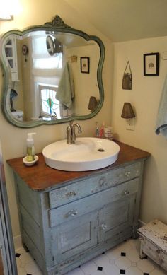 an old dresser is turned into a bathroom vanity with a mirror above it and the words vintage plumbing fixtures