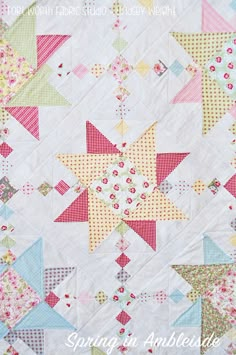 a colorful quilt is shown with the words spring in an english garden written below it