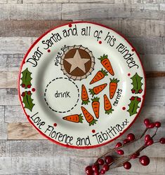 a christmas plate with carrots and holly on it