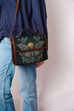 "Vintage Gothic Moth Dark Academia Messenger Bag Alternative Alt Outfit Goth College School Tablet Bag Retro Butterfly Shoulder Nature Forest  Purse Crossbody Cottage Core  Please scroll down and continue reading             This bag is crafted from high-grade tarpaulin, designed with women in mind. It measures 10.8\"(L) x 4.13\"(W) x 7.87\"(H) and showcases all-over printing. The edges, handles, and shoulder straps are neatly finished in black, with khaki stitching adding a touch of elegance. I Dark Academia Purses, Dark Academia Messenger Bag, Cottage Core Purse, Gothic Crossbody Shoulder Bag For School, Gothic Brown Bag For Everyday Use, Gothic Brown Bag, Gothic Satchel For Everyday Use, Gothic Rectangular Satchel For Daily Use, Dark Academia Bag