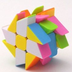 a colorful rubik cube is shown on a white surface