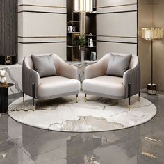 two white chairs sitting on top of a marble floor