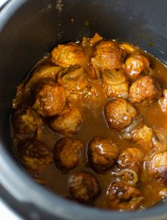 meatballs and mushrooms are being cooked in the slow cooker to make soup or stew