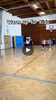 children are playing basketball in an indoor gym with the words, warm up for kids