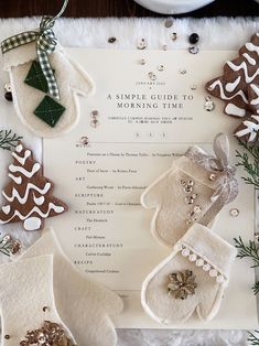 christmas cookies and mittens are laid out on top of a menu for the holiday season