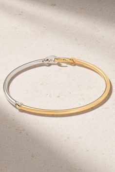 The mixed metal design of MAOR's bracelet is inspired by the twice-yearly 'Equinox' that splits Earth's day in half - 12 hours of light and 12 hours of dark. It's cast from 18-karat yellow and white gold in a slim shape that's ideal for stacking with other styles. Mixed Metal Bracelet Stack, Simple Gold Bangle, Mixed Metal Bracelets, Solid Gold Bracelet, White Bracelet, Mixed Metal Jewelry, Dream Gift, Gold Bead Bracelets, White Bracelets