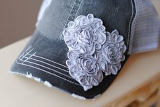 Women's Hats, Hats, Trucker Hats, Baseball hats, Women's Baseball Caps, Women's Trucker Hat. You will receive the flowers as shown on a hat of your choice. All hat options are in the additional pictures. Women's hat fits approx. 8 yrs to adult. Three chiffon gray flowers. Pictured on a gray trucker hat! You will receive the three gray flowers on any hat you choice from the drop down menu. Ponytail Adjustable back Great for on the go days! Custom orders welcome. Each flower will vary slightly but Adjustable Gray Trucker Baseball Cap, Adjustable Gray Snapback Baseball Cap, Gray Snapback Trucker Hat One Size, Gray Snapback Trucker Hat, Bling Hats, Hat Ponytail, Cadet Hat, Women Trucker, Womens Hats