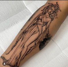 a woman's arm with a tattoo on it