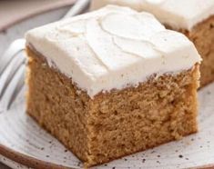 two pieces of cake on a plate with a fork