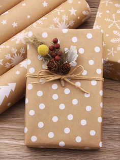 wrapping paper wrapped in brown and white polka dots with pine cones, berries and acorns