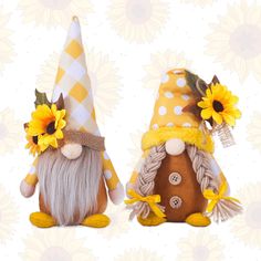 two gnomes with sunflowers on their heads are sitting next to each other