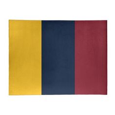 a red, yellow and blue rug on a white background with the colors of the flag