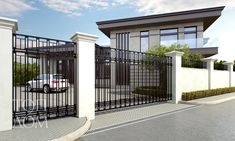 a white car is parked in front of a house with black iron fence and gate