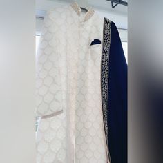 Size: 40r Color: White/ Navy Comes With A Custom Made Velvet Shawl 100 Percent Handwork Brand New!! Formal White Kurta With Dupatta, Elegant White Bandhgala With Dupatta, Elegant White Kurta With Pallu Detail, Elegant White Kurta With Pallu, Luxury White Winter Sherwani, Fitted White Winter Sherwani, Designer White Kurta With Zari Work, Designer White Kurta For Wedding, Formal White Kurta With Pallu Detail