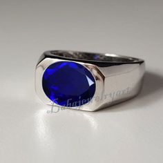 Blue Sapphire Ring, Sapphire Signet Ring Men, Mens Gemstone Ring, Blue Sapphire Quartz Ring Men, Oval Sapphire Mens Ring, Sapphire mens ring, Cocktail Ring, Statement Ring, Gift For Husband Blue Sapphire Rings For Men Item Details Handmade item Metal Purity - 92.5% Sterling silver Gemstone name :- Blue Sapphire Gemstone shape:- Oval Stone Quality - Lab Created Stamped - 925 Stamp on ring band Ring Size - All sizes available ( For custom ring size please contact ) This ring 925 Sterling Silver fe Blue Oval Signet Promise Ring, Blue Oval Signet Ring For Promise, Modern Blue Oval Signet Ring, Modern Blue Gemstone Signet Ring, Blue Signet Ring With Polished Finish For Promise, Blue Oval Signet Ring With Gemstone, Classic Blue Oval Signet Ring, Sapphire Signet Ring, Mens Sapphire Ring