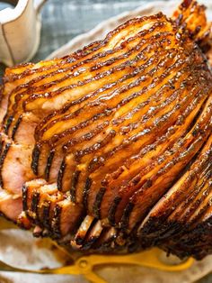 sliced ham sitting on top of a white plate