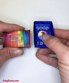 someone is holding a candy bar with the word good written on it next to another one