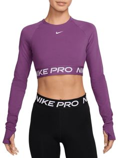 Get your sweat on in this cropped Nike Pro top. Lightweight and stretchy, the smooth fabric dries quickly to help you stay ready when your workout heats up. With a body-hugging fit and soft jacquard elastic band at the hem, you can feel secure as you crush your goals. Fit & Design: Tight fit: snug and form-fitting Nike Dri-FIT technology moves sweat away from your skin for quicker evaporation, helping you stay dry and comfortable Thumbholes let you extend your coverage and help hold the sleeves in place while you move Cropped Nike, Compression Top, Womens Athletic Outfits, Cropped Long Sleeve Top, Workout Fits, Athletic Apparel, Athletic Outfits, Nike Pros, Nike Dri Fit