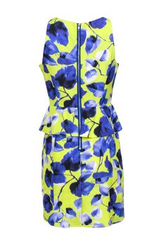 Get ready to make a statement in this lively lemon yellow and indigo floral printed dress from Milly! Featuring stylish floral accents and a flattering peplum cut, this spring must-have will take your fashion game to the next level. Simply add a nude heel to complete the look! Size 8 Made in USA Shell 58% Cotton, 42% Viscose Lining 100% Polyester Exposed back zipper Sleeveless Back peplum detail Bust 36" Waist 30" Shoulder to hem 36" Spring Floral Print Peplum Dress, Blue Peplum Dress For Spring, Fitted Floral Print Peplum Dress, Sleeveless Lemon Print Dress For Spring, Indigo Floral, Floral Printed Dress, Nude Heels, Size 8 Dress, Lemon Yellow