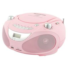 a pink radio that is sitting on top of a white surface with an alarm clock