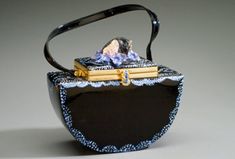 This artistic bag is based on the story of sleeping beauty. A sculpture head sits on top of a this two tier bag surrounded by antique glass flowers beads.  Detailed stippled painting adds to the true art of this unique bag. I began making this bag the same way I approach one of my art pieces. Much of my art work has been inspired by fairytales. Why can't a handbag be an art piece? Why can't we take our art out with us? What fun! Elegant Hand Painted Rectangular Bag, Elegant Hand Painted Rectangular Bags, Artistic Rectangular Evening Bag, Fashion Objects, Accessories Matching, Unusual Handbags, Artist Bag, Flowers Beads, Sculpture Head