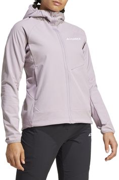 Layer up in this adidas Terrex softshell fleece jacket and stay comfortable on the trail. Its lightweight build won't weight you down, and hike-friendly features like raglan sleeves for mobility and backpack-friendly seams help you get the most out of your time outdoors. A high collar and hood are there for extra protection when you need it. Stash essentials in the mix of convenient pockets for easy access on the go. This product is made with at least 70% recycled materials. Fit & Design: Regular fit Backwards shifted shoulder seam for extra comfort while wearing a backpack Slightly longer back construction Slightly longer sleeve construction Full zip with high collar and hood Embroidered TERREX logo on left chest Side zip pockets Chest pocket with zip Sleeve Construction, Womens Athletic Outfits, Adidas Terrex, Athletic Apparel, Athletic Outfits, The Trail, High Collar, Recycled Materials, Raglan Sleeve