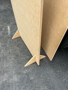 an open cardboard box sitting on the ground