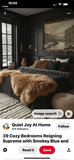 a bedroom with black walls and fur on the bed