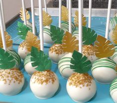 there are many cake pops with leaves on them