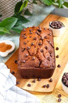 a loaf of chocolate chip bread on a cutting board