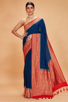 Buy blue tussar Banarasi saree online in USA with red zari border. Look your best on festive occasions in latest designer saris, pure silk sarees, Kanjivaram silk sarees, handwoven saris, tussar silk sarees, embroidered sarees from Pure Elegance Indian clothing store in USA.-full view Red Semi-stitched Saree With Embroidered Border, Blue Saree With Red Border, Royal Blue Semi-stitched Saree, Red Tussar Silk Pre-draped Saree For Puja, Luxury Blue Tussar Silk Pre-draped Saree, Fashion Journals, Tussar Silk Saree, Traditional Fabric, Banarasi Sarees