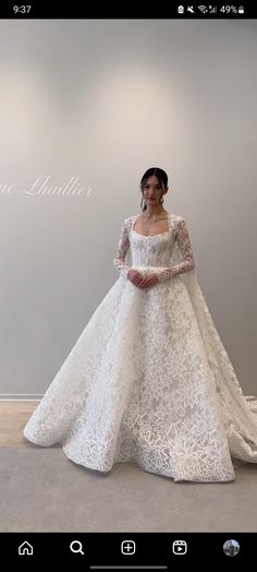 a woman in a white wedding dress is posing for the camera with her hands on her hips