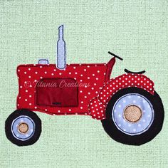 a red tractor with polka dots on it