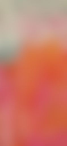 blurry image of an orange and pink background