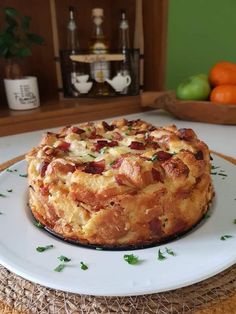 a pizza sitting on top of a white plate