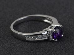 Welcome to my shop, you can find many beautiful gemstone jewelry here, and you also can ask for customized service. Main Stone: amethyst, round cut 6X6mm, 0.80 carats Accent Stones: cz Metal: 925 sterling silver plated with rhodium. I also can provide metal options such as 14k solid yellow/white/rose goldSetting: prong setting More rings: https://www.etsy.com/shop/XCjewelryStudio?ref=hdr_shop_menuIt's a perfect gift for the person who was born in February (Birthstone), it's quite comfortable for Engagement Ring Round Cut, February Birthstone Ring, Born In February, Engagement Ring Round, Round Cut Engagement Rings, Engagement Rings Round, Rings Engagement, February Birthstone, February Birth Stone