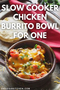 A chicken burrito bowl filled with diced tomatoes, brown rice, black beans, and corn, topped with melted shredded cheese and chopped cilantro. Slow Cooker Chicken Burrito Bowl, Spagetti And Meatball Recipe, Crockpot Recipes For Two, Mini Crockpot Recipes, Meal For One, Cooking The Perfect Steak