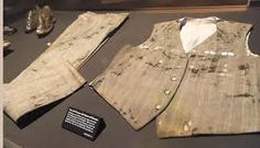 two pieces of clothing are on display in a museum