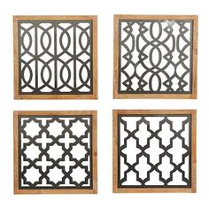 four metal wall art pieces with wooden frames on the sides and one has an intricate design