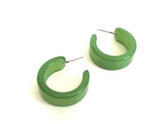 "Sea glass green hoop earrings which are freshly made with vintage parts and in a shiny moonglow finish. This style is known as the Wide Classic Hoops & they measure approximately 1\" in diameter and about 15mm in width. The Wide Classics are available in loads of different colors & in frosted or moonglow finishes. Most all earrings are made with vintage lucite parts that were made in Rhode Island in the 1960's - early 80's by Best Plastics. We hand-set them with surgical steel earring p Modern Green Round Hoop Earrings, Green Jade Hoop Earrings, Modern Small Green Hoop Earrings, Modern Handmade Green Hoop Earrings, Vintage Green Hoop Earrings For Gift, Vintage Green Hoop Earrings Gift, Vintage Green Hoop Earrings As Gift, Green Hoop Earrings, Sea Glass Green