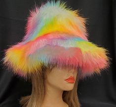 A Sorbet Rainbow of colors waving over white fur...lightweight and super warm! Lined in polar fleece to keep you warm and cosy. All our hats are good for the planet, and are hand sewn by me right here in the USA, using premium quality vegan friendly faux fur. Unisex sizes S-M-L available. Custom made just for you, and ready to ship within a couple of days. If you're not sure which size to order, just measure the circumference of your head ( all the way around the widest part, starting at your fo Multicolor Wide Brim Bucket Hat For Winter, Wide Brim Multicolor Bucket Hat For Winter, Winter Wide Brim Multicolor Bucket Hat, Multicolor Wide Brim Mini Hats For Winter, Multicolor Bucket Hat For Winter Festival, Multicolor Flat Brim Winter Hat, Rave Hats, Hippie Hat, Fur Bucket