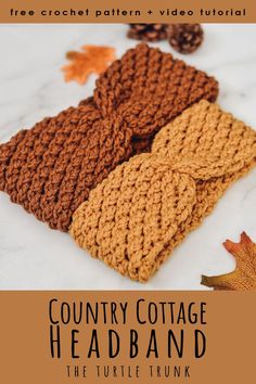 three knitted headbands sitting on top of a white table next to autumn leaves