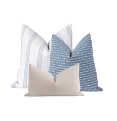 three pillows with blue and white stripes on them